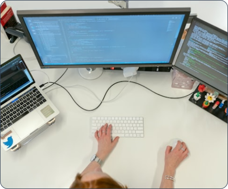 Digital workspace with computers and development tools